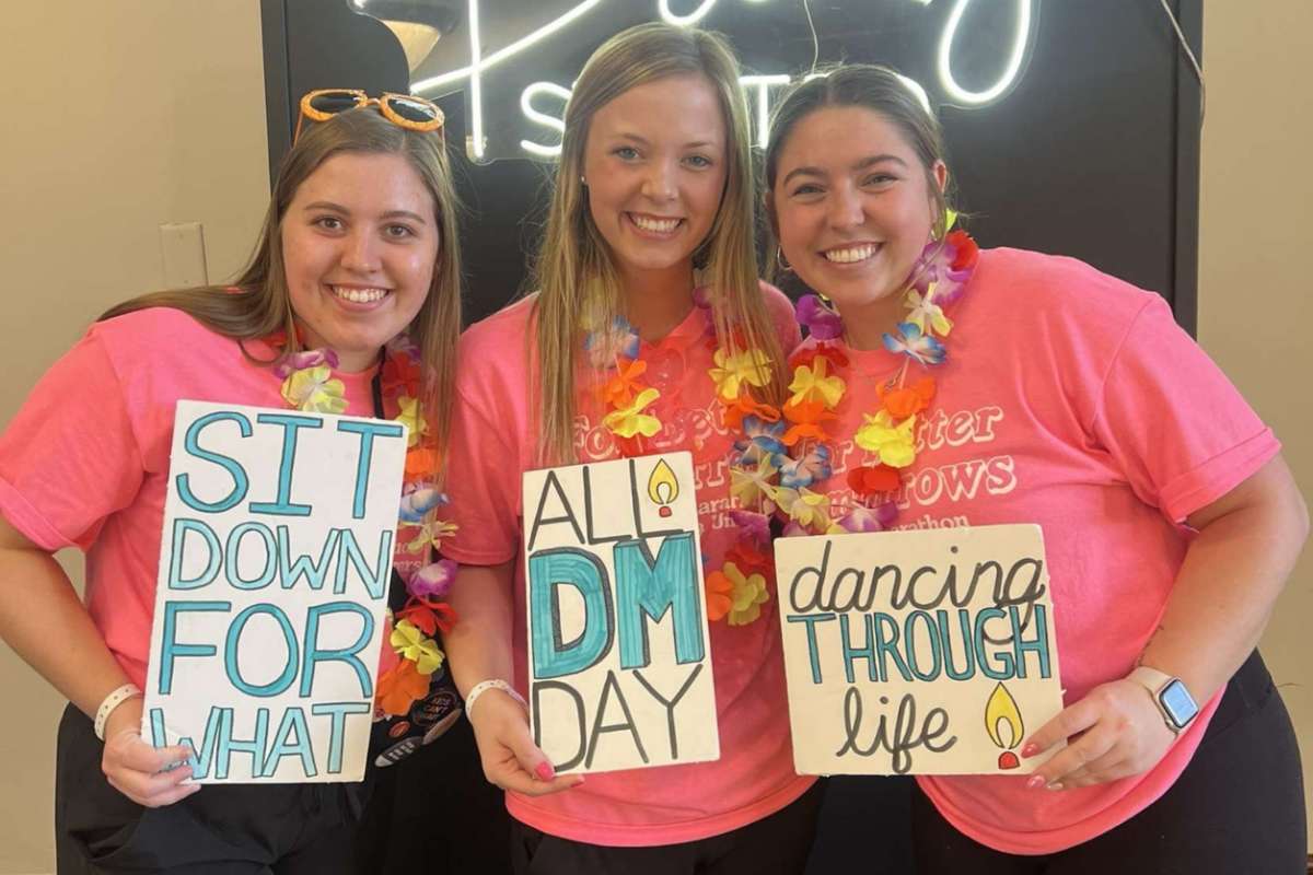 Members posing at the photo booth during the big event