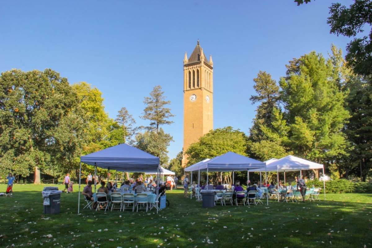 Tents and tables in front of the campanile at Stacks for Stead 2023